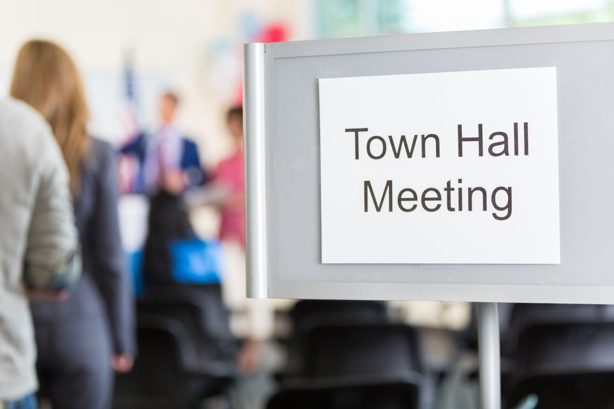 img (3) A sign that says town hall meeting